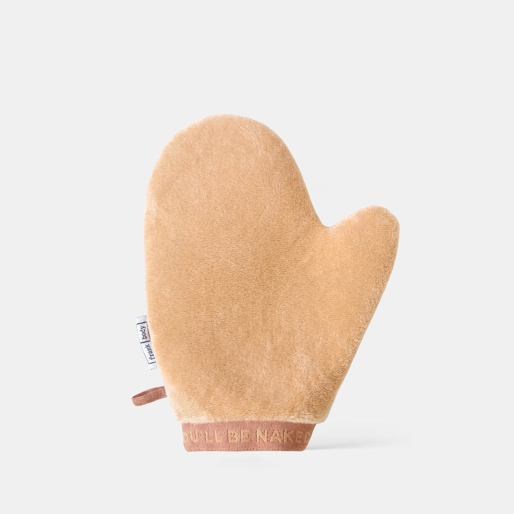 The frank body Double Trouble Tanning Mitt, a plush tan applicator mitt.