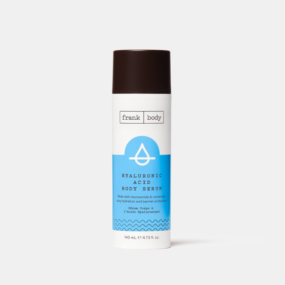 A blue and white bottle of frank body Hyaluronic Acid Body Serum.