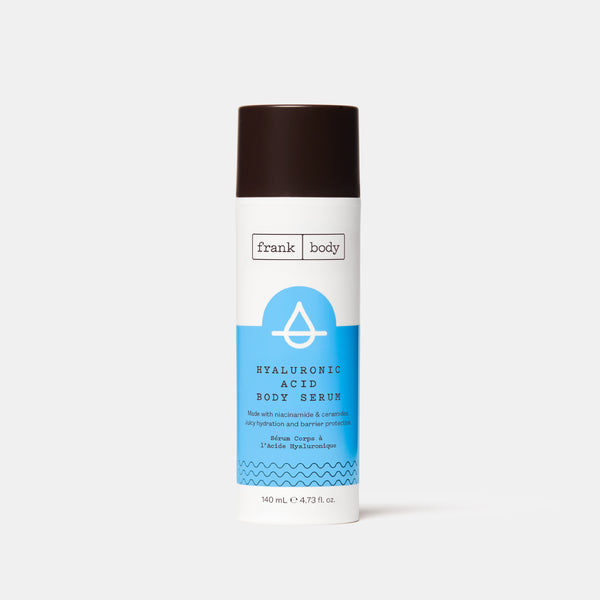 A blue and white bottle of frank body Hyaluronic Acid Body Serum.