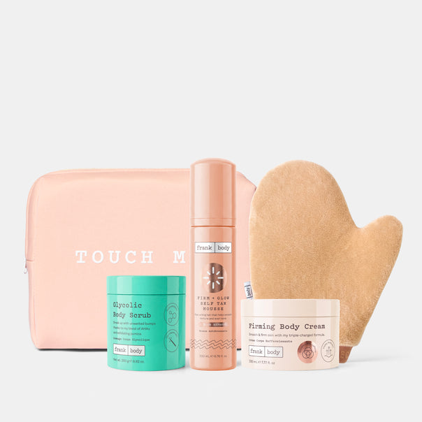The frank body Everything Shower Kit: Glycolic Body Scrub, Firm + Glow Self Tan Mousse and Firming Body Cream with a tanning mitt and pink pouch.