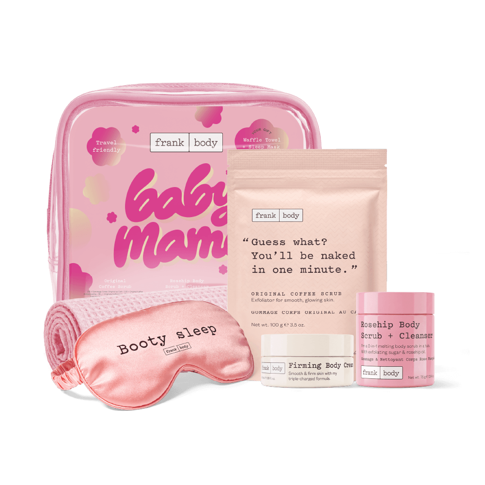 The frank body Baby Mama Kit: a pink travel bag, waffle towel and Booty sleep eye mask with the Original Coffee Scrub, Firming Body Cream and Rosehip Body Scrub + Cleanser.