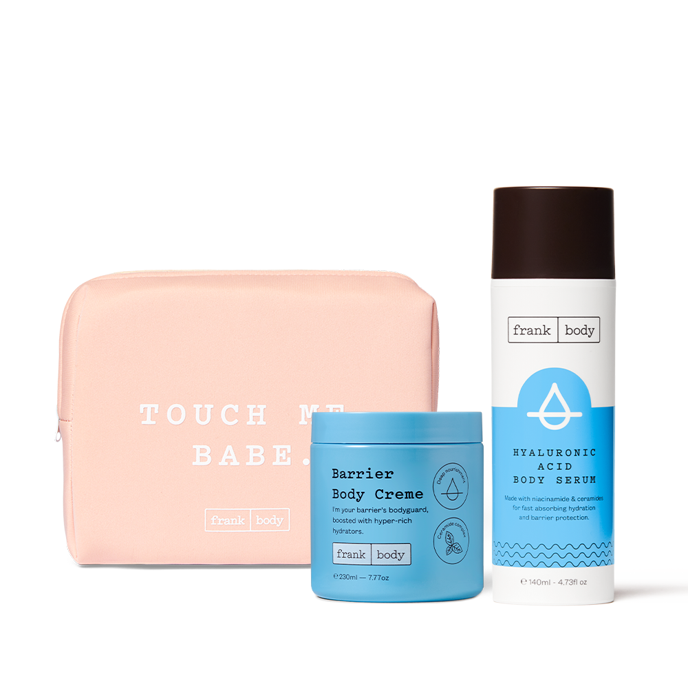 The frank body Juicy Treats Kit: Barrier Body Creme and Hyaluronic Acid Body Serum with a pink Touch Me Babe pouch.